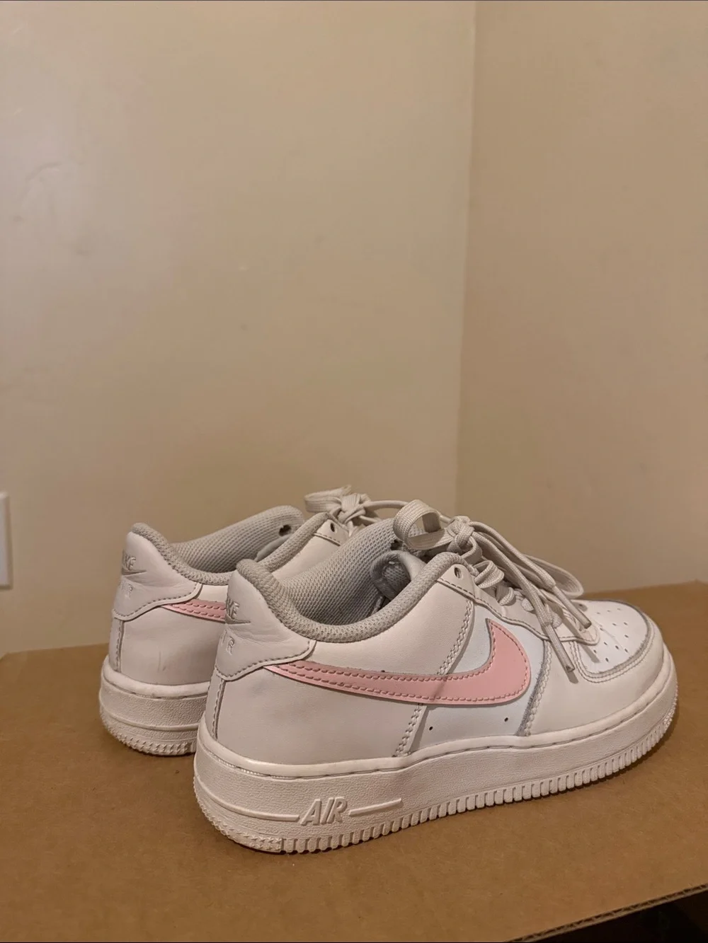 Nike White Low-Top Sneakers with Pink Swoosh